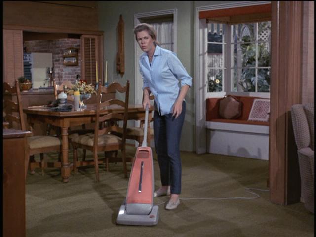 Would an old-fashioned witch vacuum? Heck no. Sam is as modern as they come.