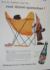 Seven-Up ad featuring the Butterfly chair. The sensitive lines (the chair’s metal legs) resemble the atomic symbol. 
